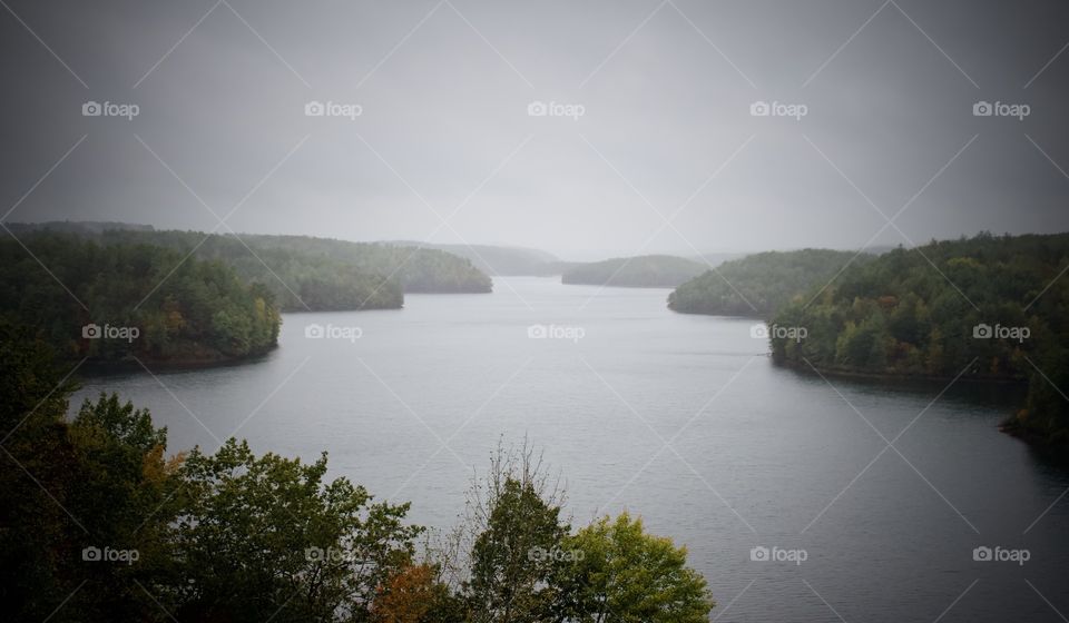 Overcast fall day on the lake in mountains.