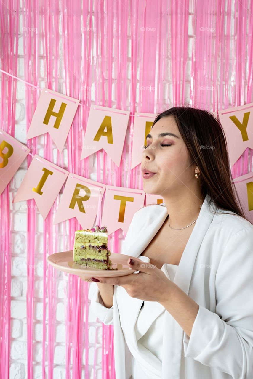 woman eating birthday cake