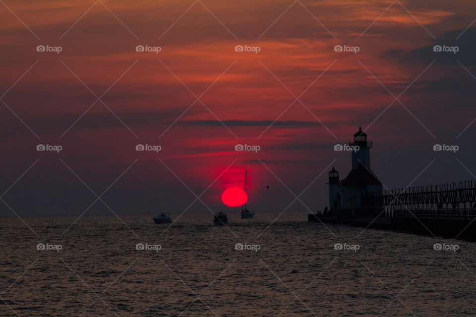 sunset cruise. boats out in the lake watching the sunset