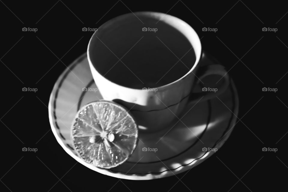 Black and white shot of cup and saucer