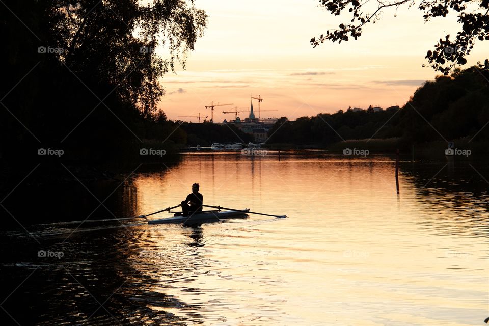 Canoeist in the sunset . Canoeist in the sunset 