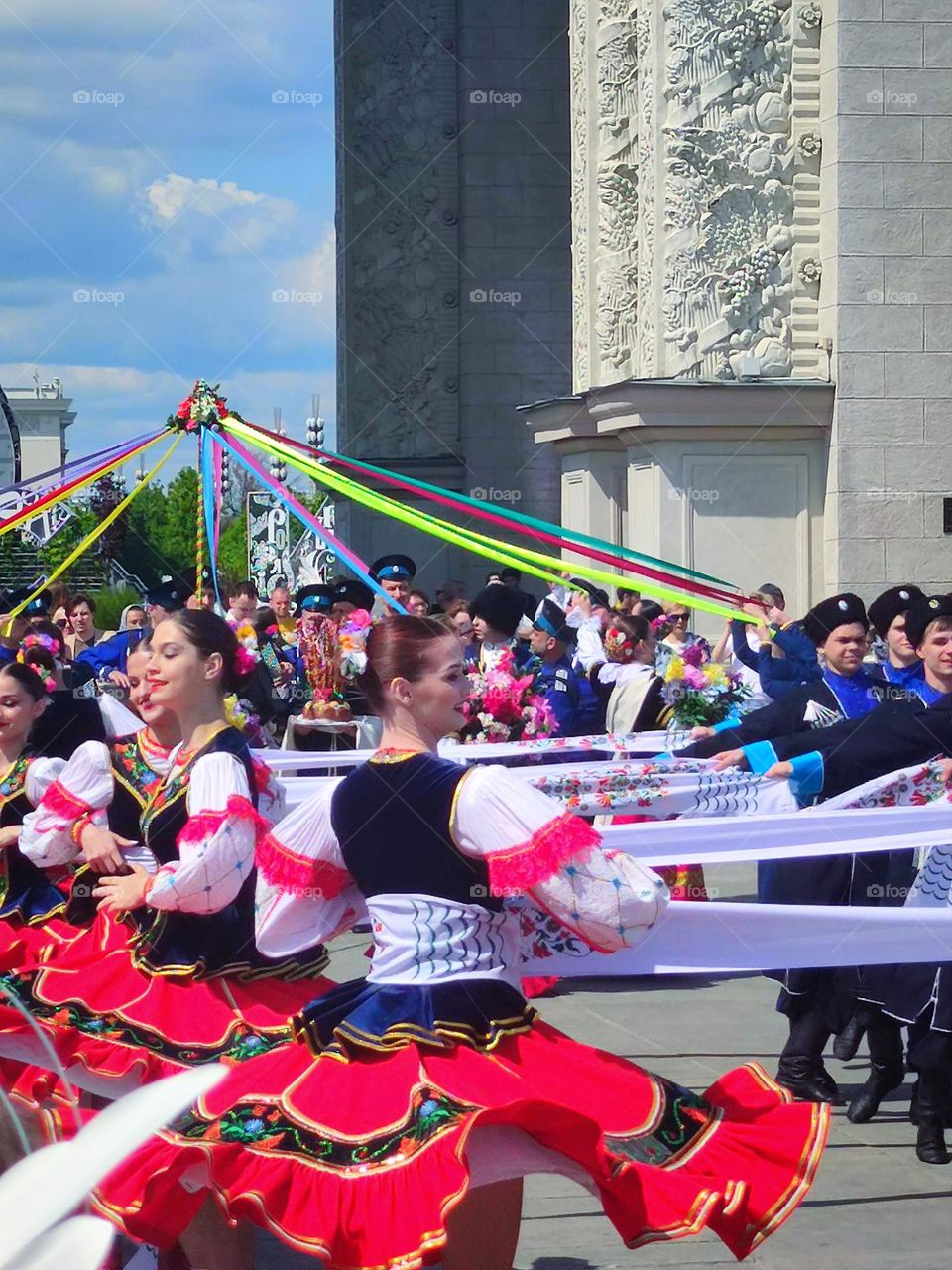 National dance of the Cossacks. Girls and men in national costumes. Round dance.Multinational Russia