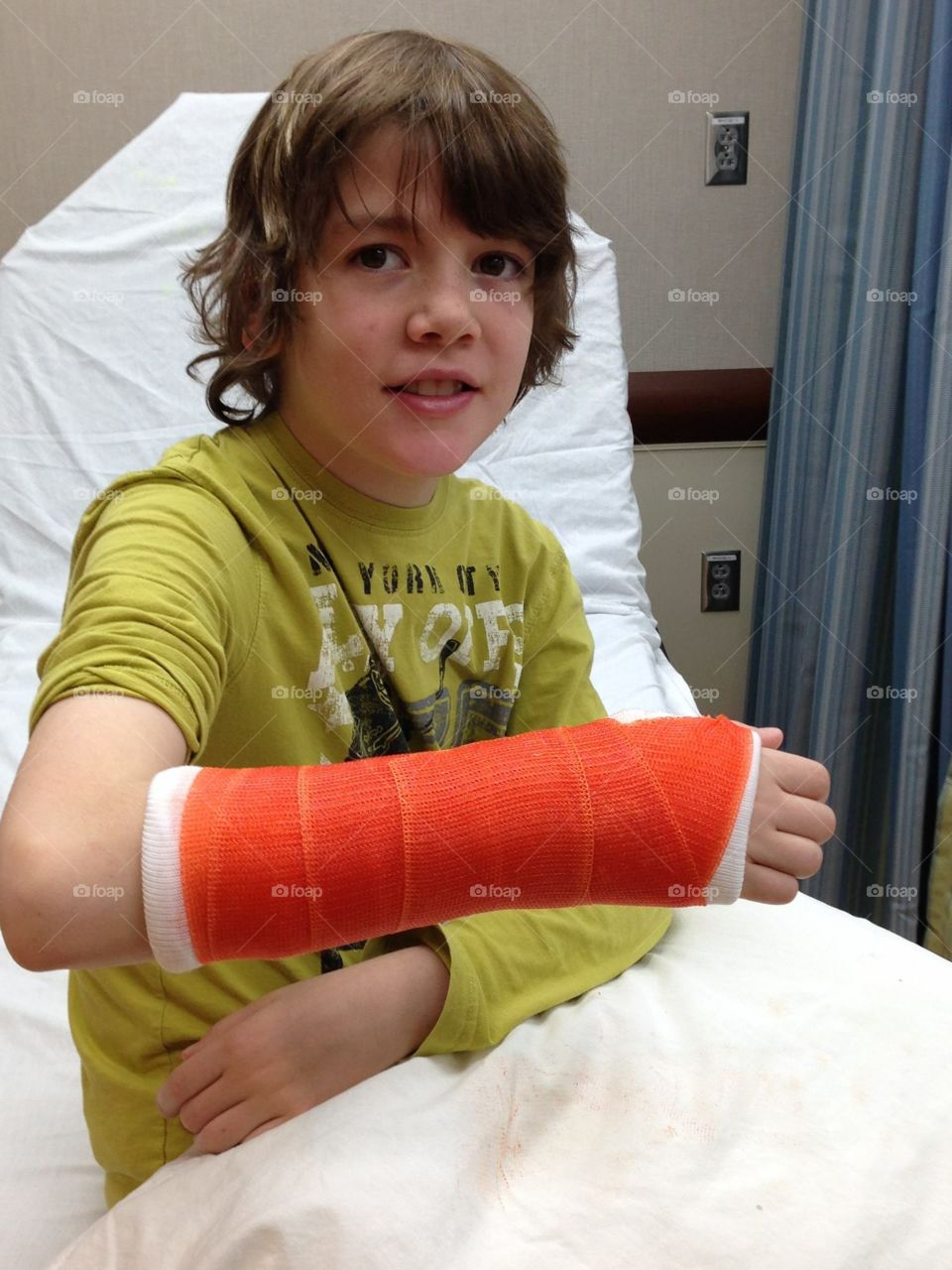 Boy with broken arm casted