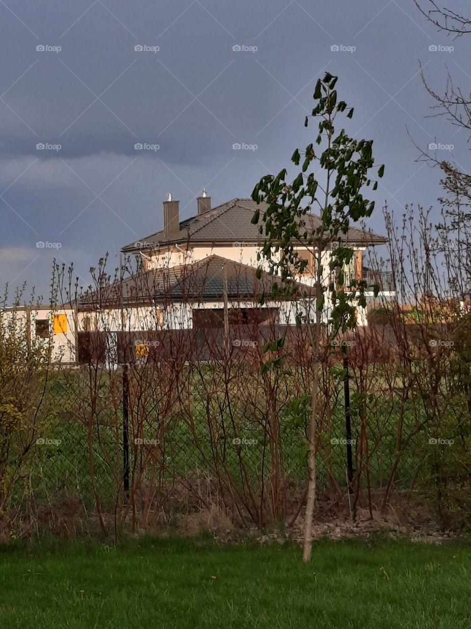 afternoon sunshine and rain clouds  in spring