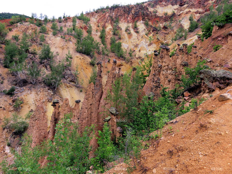 Strange earth elevations due to erosion with rock on top