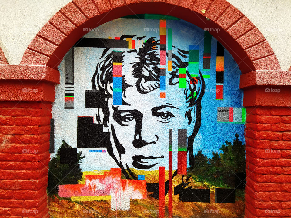 Graffiti in the form of the face of the Russian poet Sergei Yesenin.  Modest smile