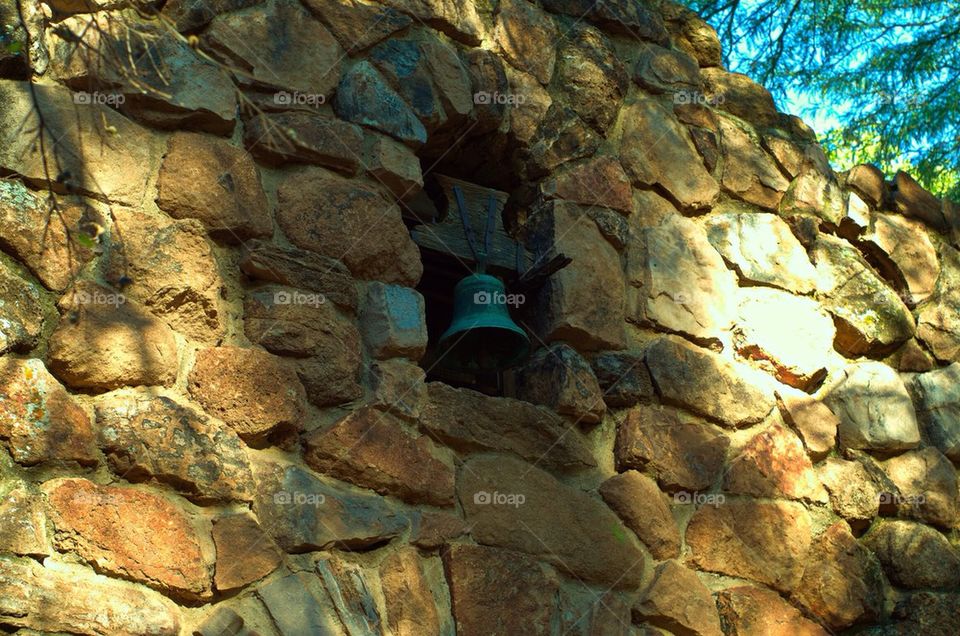 Bell in stone wall