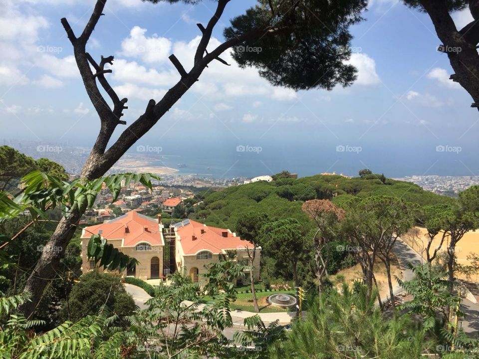 A picture from the top of a mountain with a view of the Mediterranean ocean and the bleu sky in Lebanon.