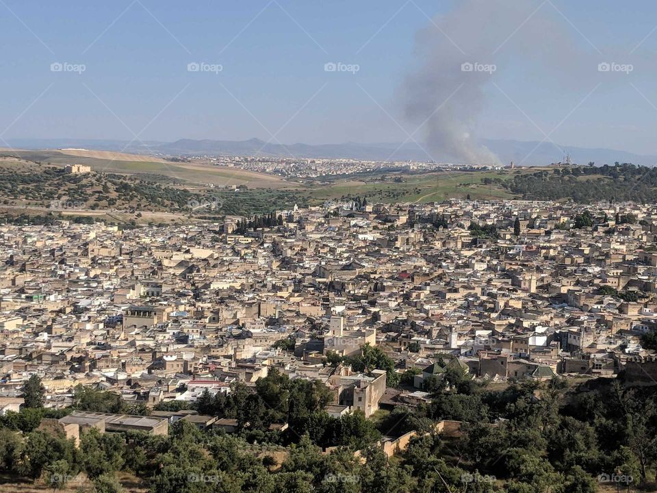Birds Eye View from Above (from a Hike) of the City Fez (Fes) in Morocco (Buildings, Trees, Smoke Spiral/Smoke Stack)