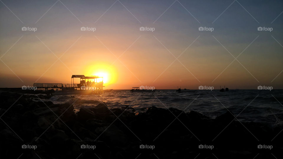Loca fishermen boats in sunset