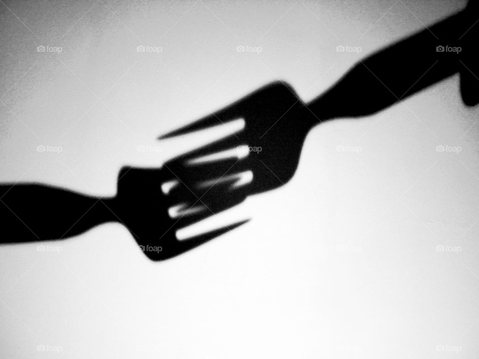 fork shadow on the wall.