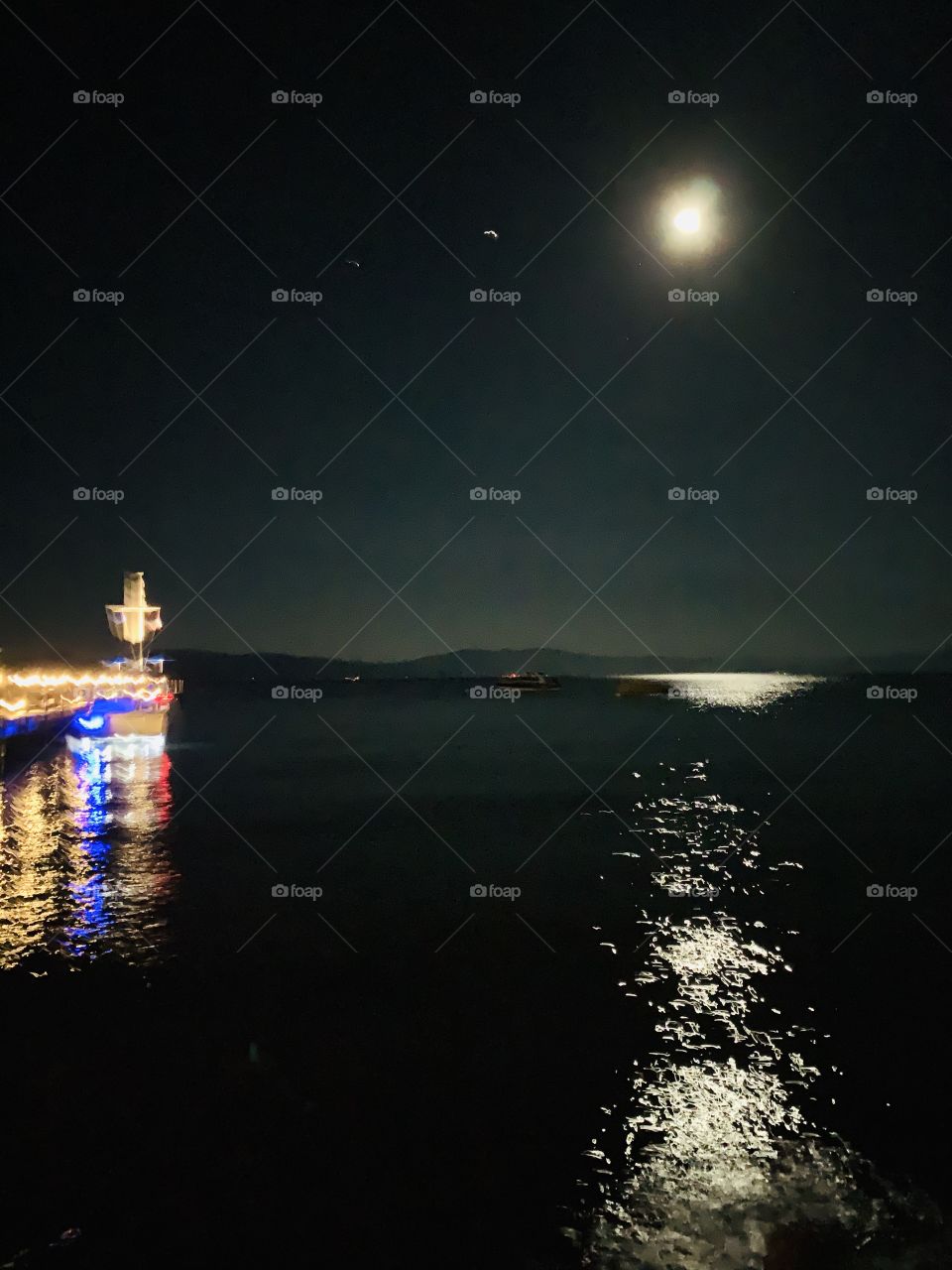 The light from the moon and the pier, reflecting off of Lake Tahoe. 