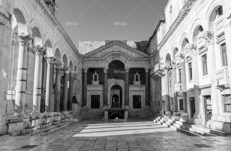 Black and white photo of empty vestibule square inside Diocltian's palace in Split, Croatia