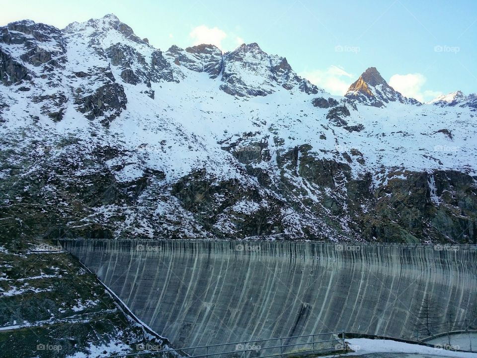A dam at high altitude, on the Alps, in the Gran Paradiso National Park.