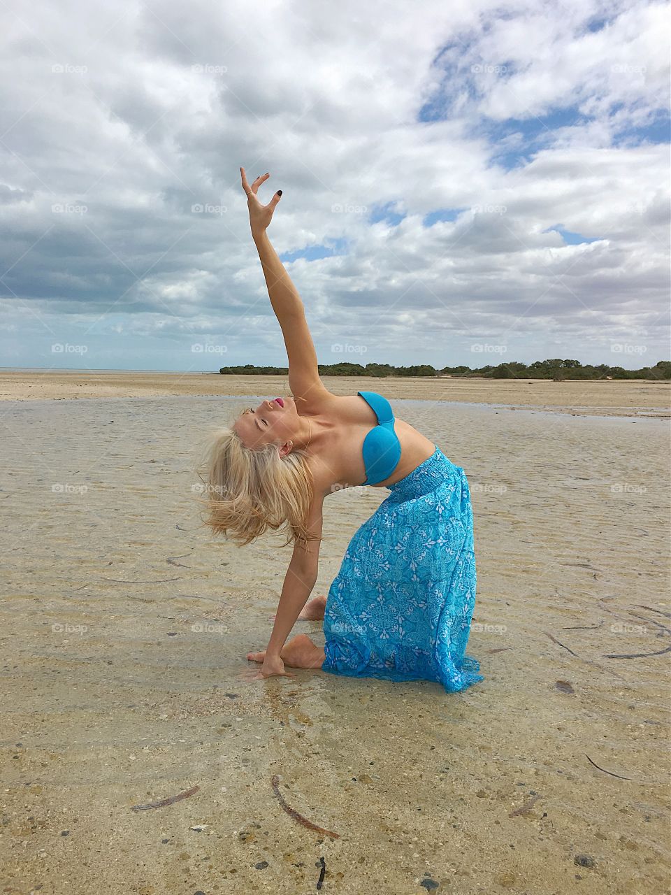 Woman dancing at beach