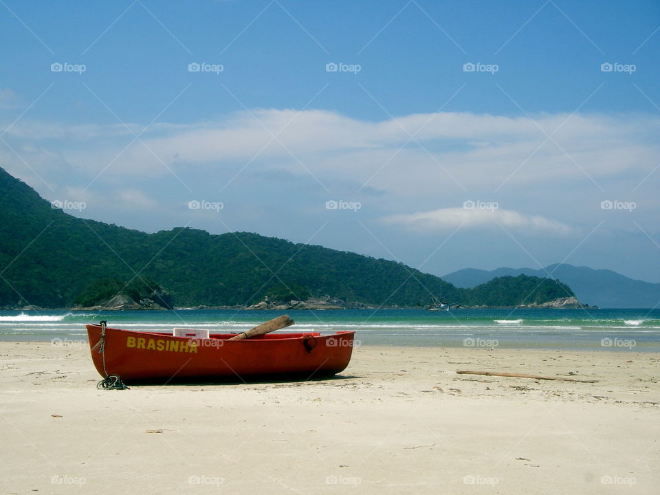 Red boat on tropical beach, Ilha Grande, Brazil