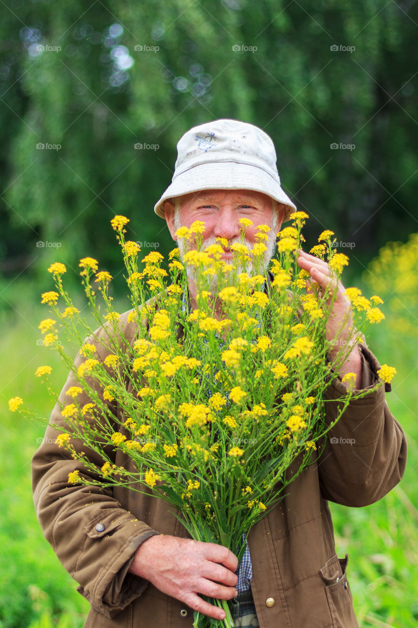 Happy man with flowers
