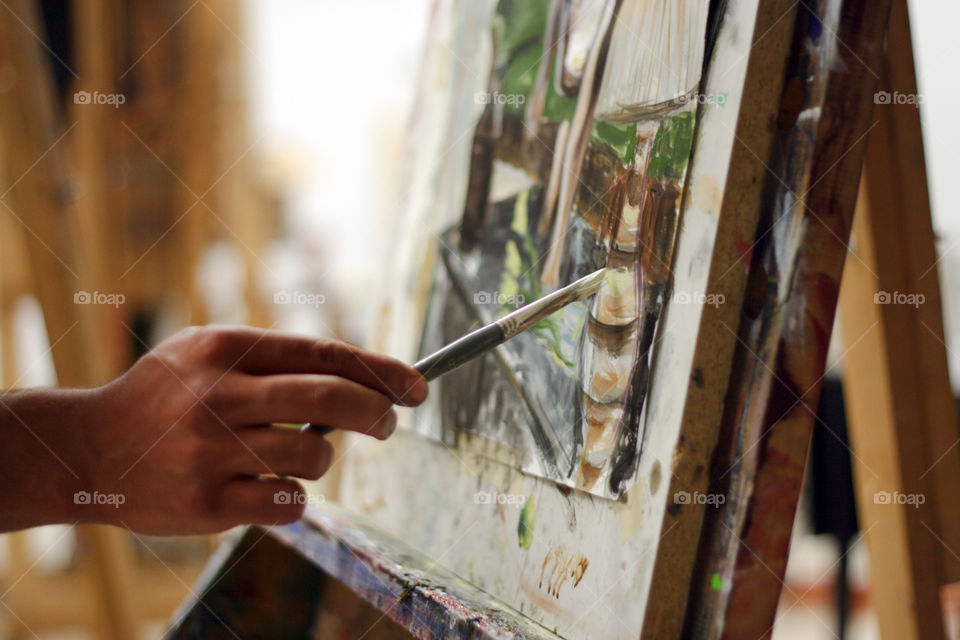 An artist paints in the studio 