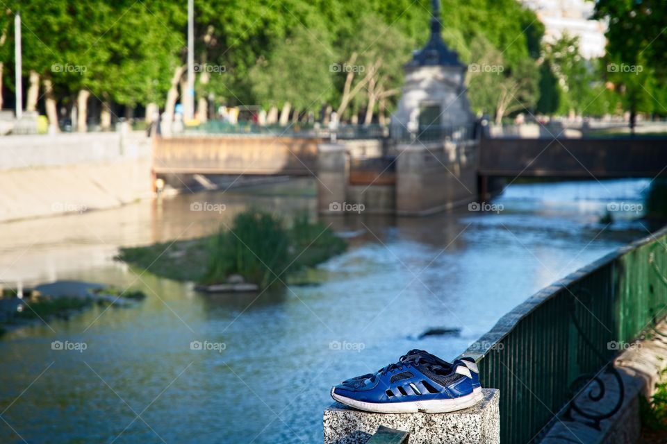 Sneakers on the edge of the river
