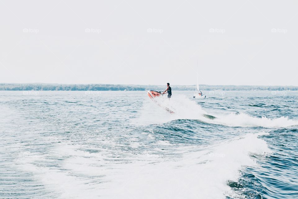 Riding waves on a skidoo