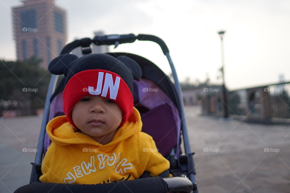 Asian girl on baby stroller 