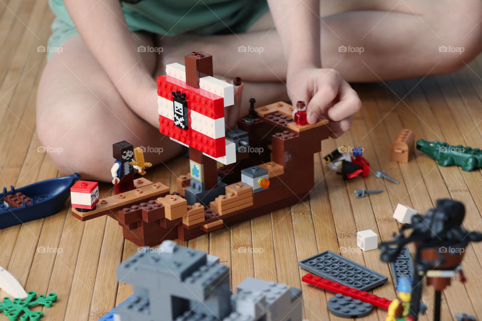 Child playing Lego pirate