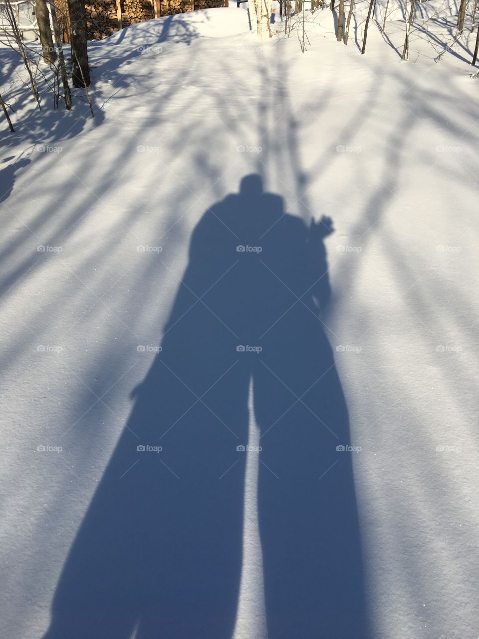 wife and i out on the snowshoe trail taking picture of our silhouette 