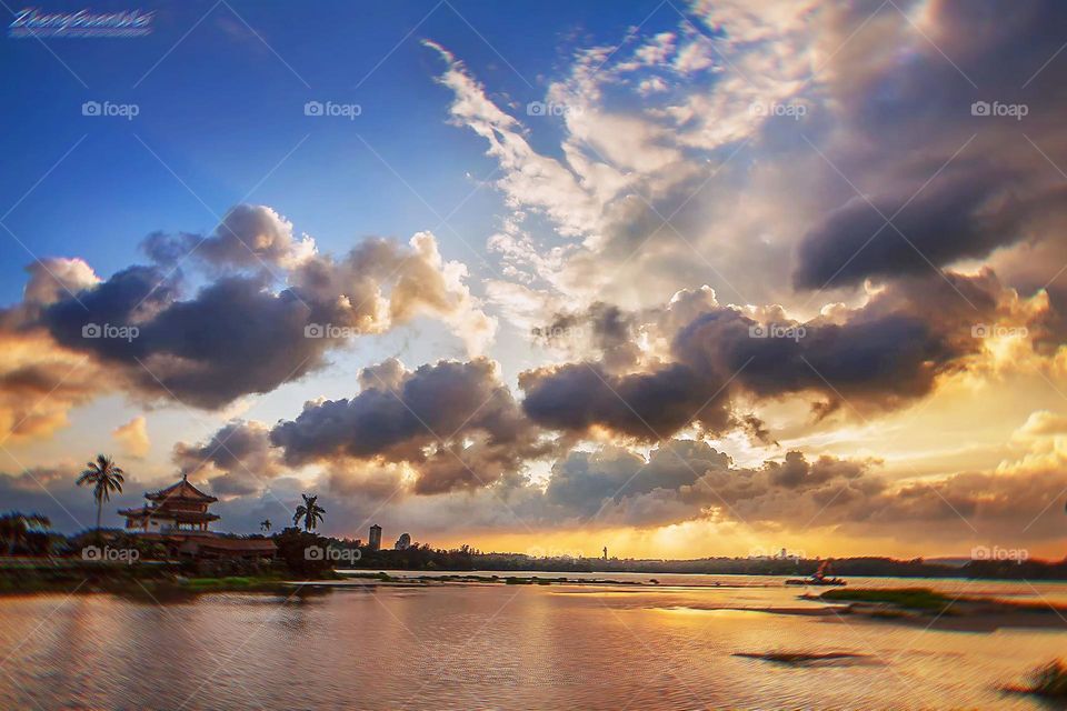 sunset clouds by the lake