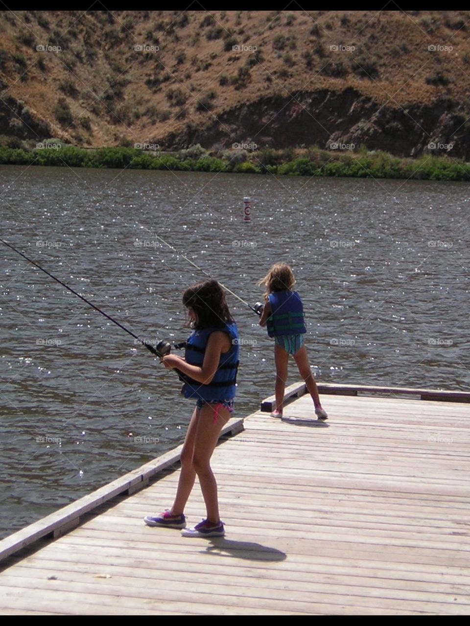 Two girls fishing