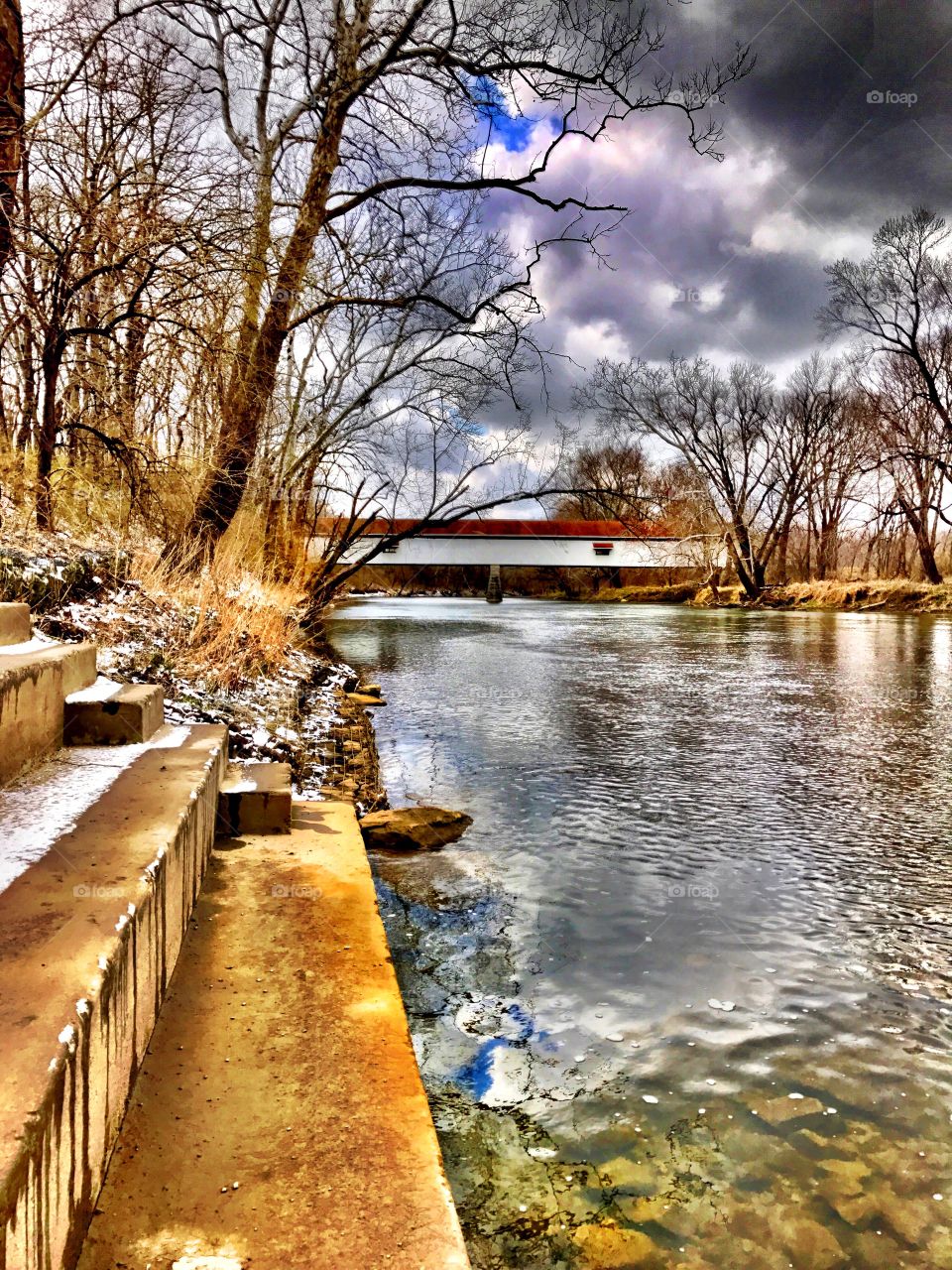 Steps down to the river and the covered bridge 