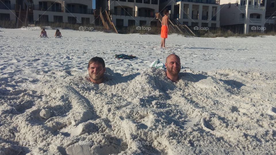 buried in sand Destin Florida