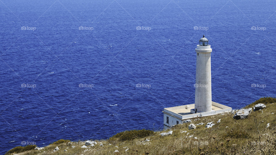 A peaceful lighthouse in front of Infinity 