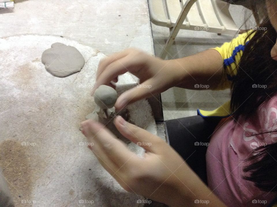 Child modeling clay