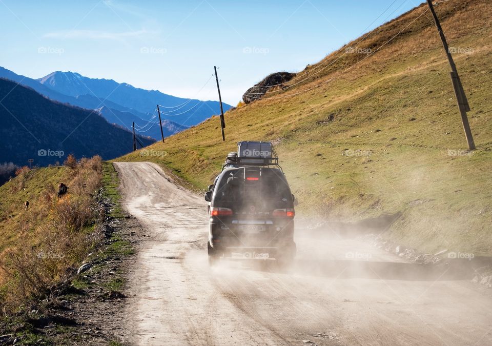 Traveler ‘s car on their long road journey 