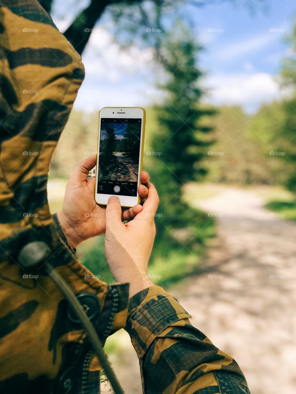 Man snapping photo with IPhone