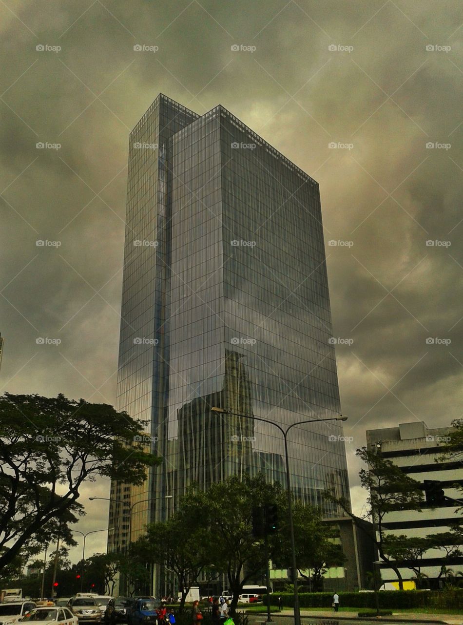 Zuellig. Building in Makati with clouds as background