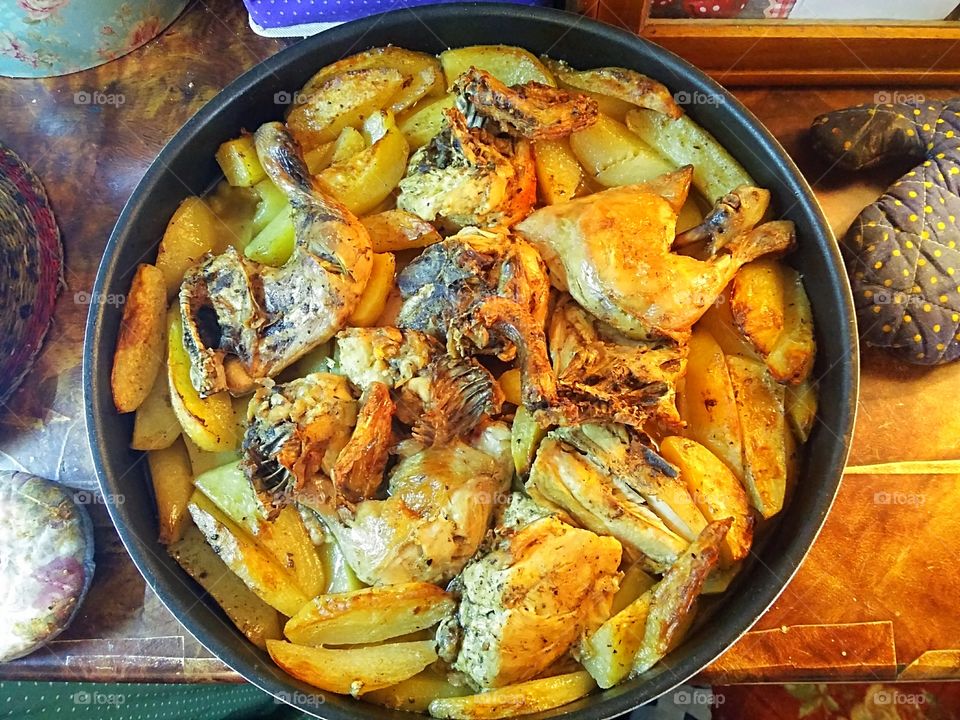 High angle view of chicken And potatoes served in bowl