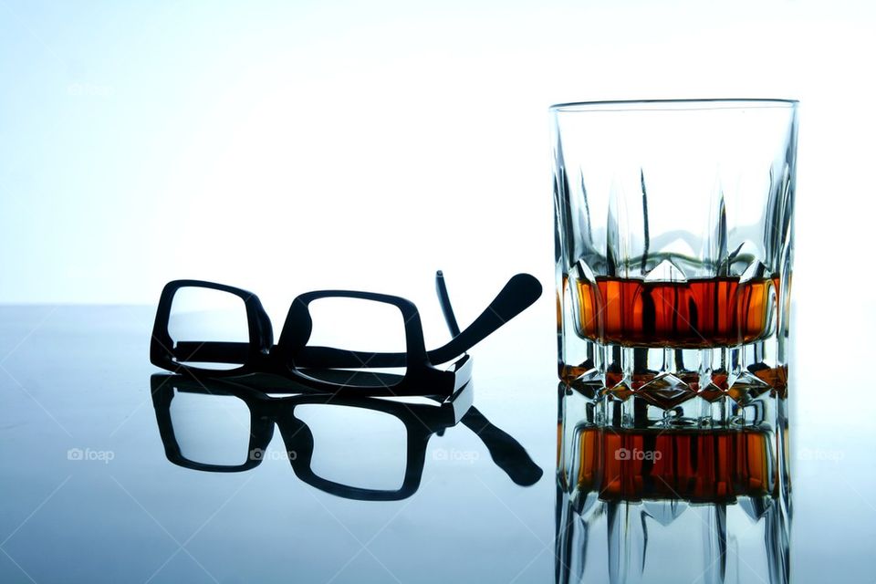 alcoholic drink and a pair of eyeglasses
