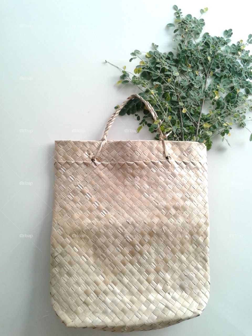 A native bag woven from buri palm leaves with horse raddish leaves(scientific name- moringa oleifera).