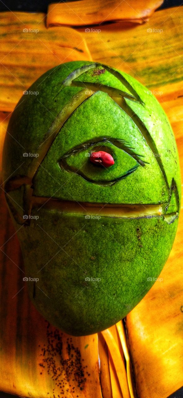The eye behind the mango