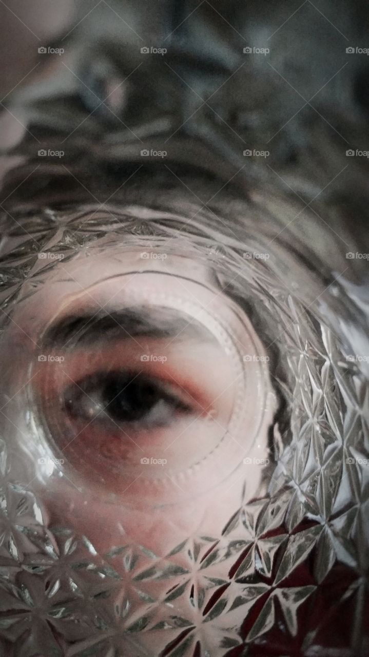 Eyeball viewed through a mason jar.