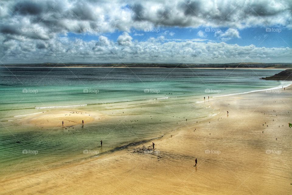 Sandbank Beach In Cornwall. A sandbank is revealed as the tide goes out in Cornwall