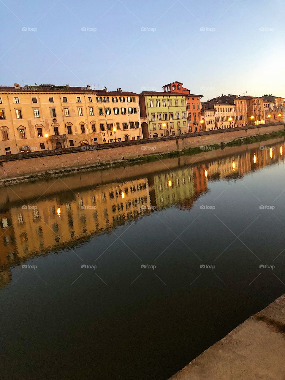 Reflections on the river in Pisa, Italy. 