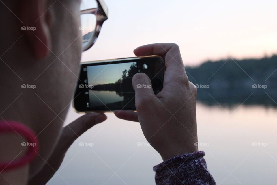 Girl taking a picture with her phone