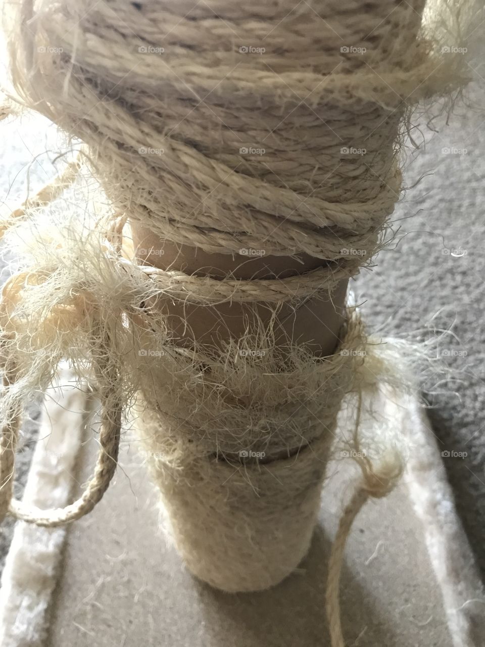 Frayed rope around cat scratcher