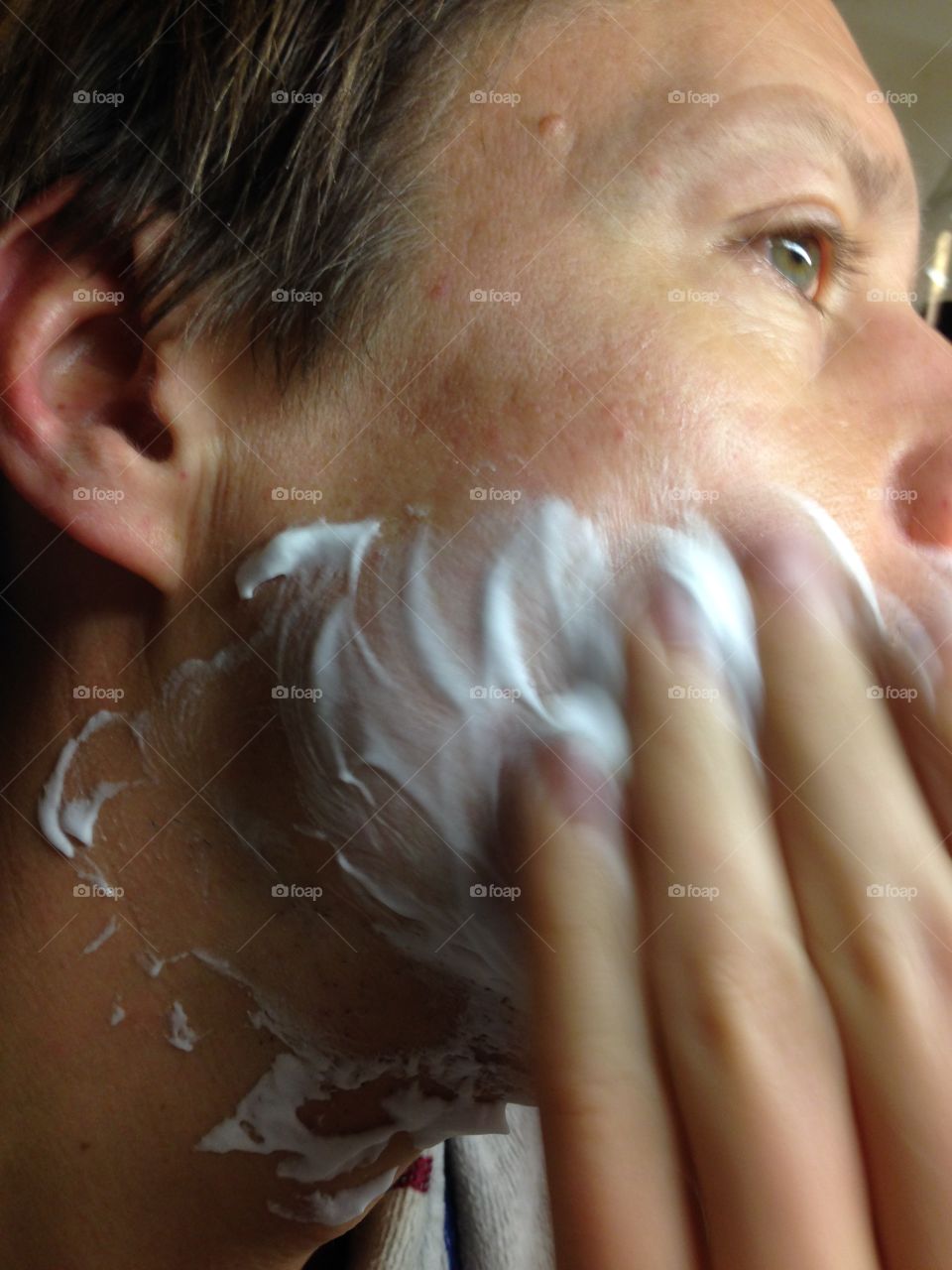 Applying shaving cream, an important part of the daily shaving ritual.