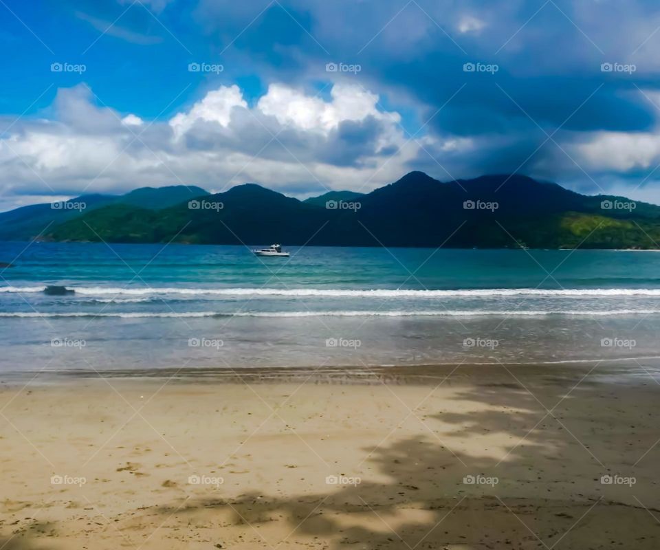 Beach in the Ilhabela Archipelago.  In the background, islands of the Archipelago with dense Atlantic Forest vegetation.