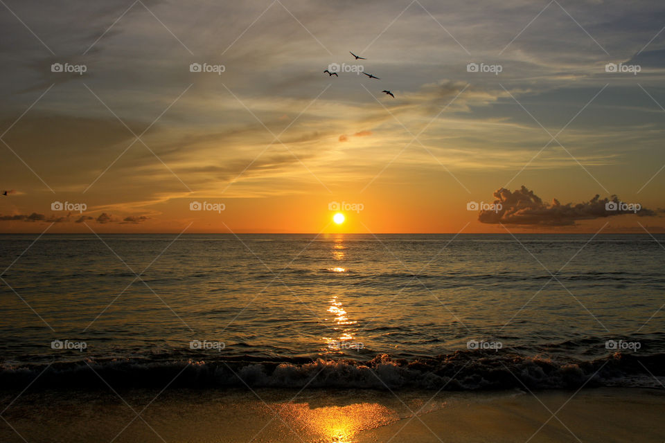 Idyllic view of sea at sunset