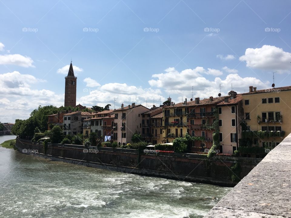 Verona Italia 

Outside of the Streets of Verona
On a Bridge looking forward to the
Beautiful Architecture of the City