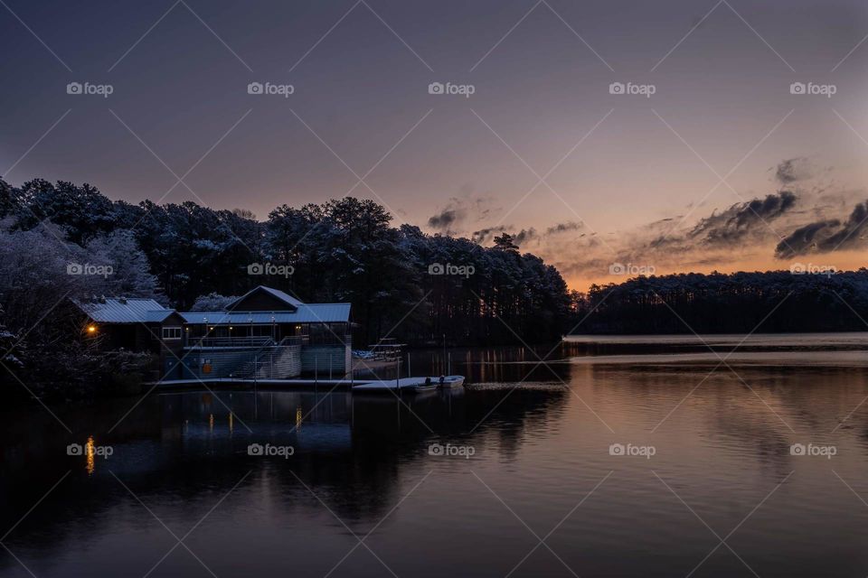 A rare snow in North Carolina. The boathouse at Lake Johnson Nature Park in Raleigh at early morning twilight. 